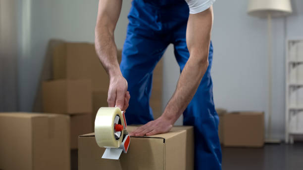 Packing and moving team handling household relocation items